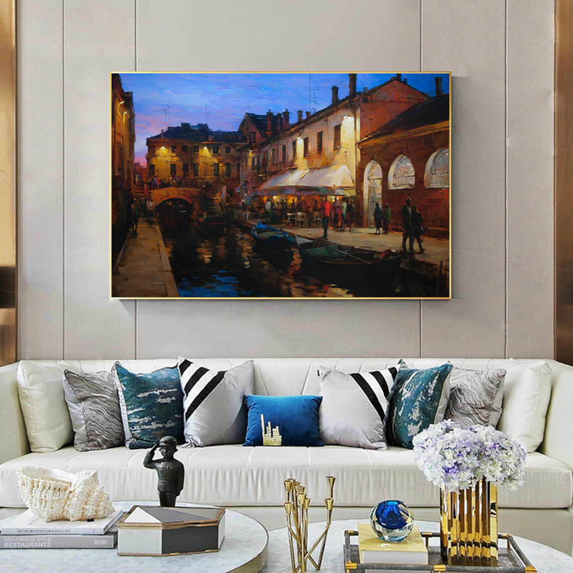 a living room filled with furniture and a painting on the wall