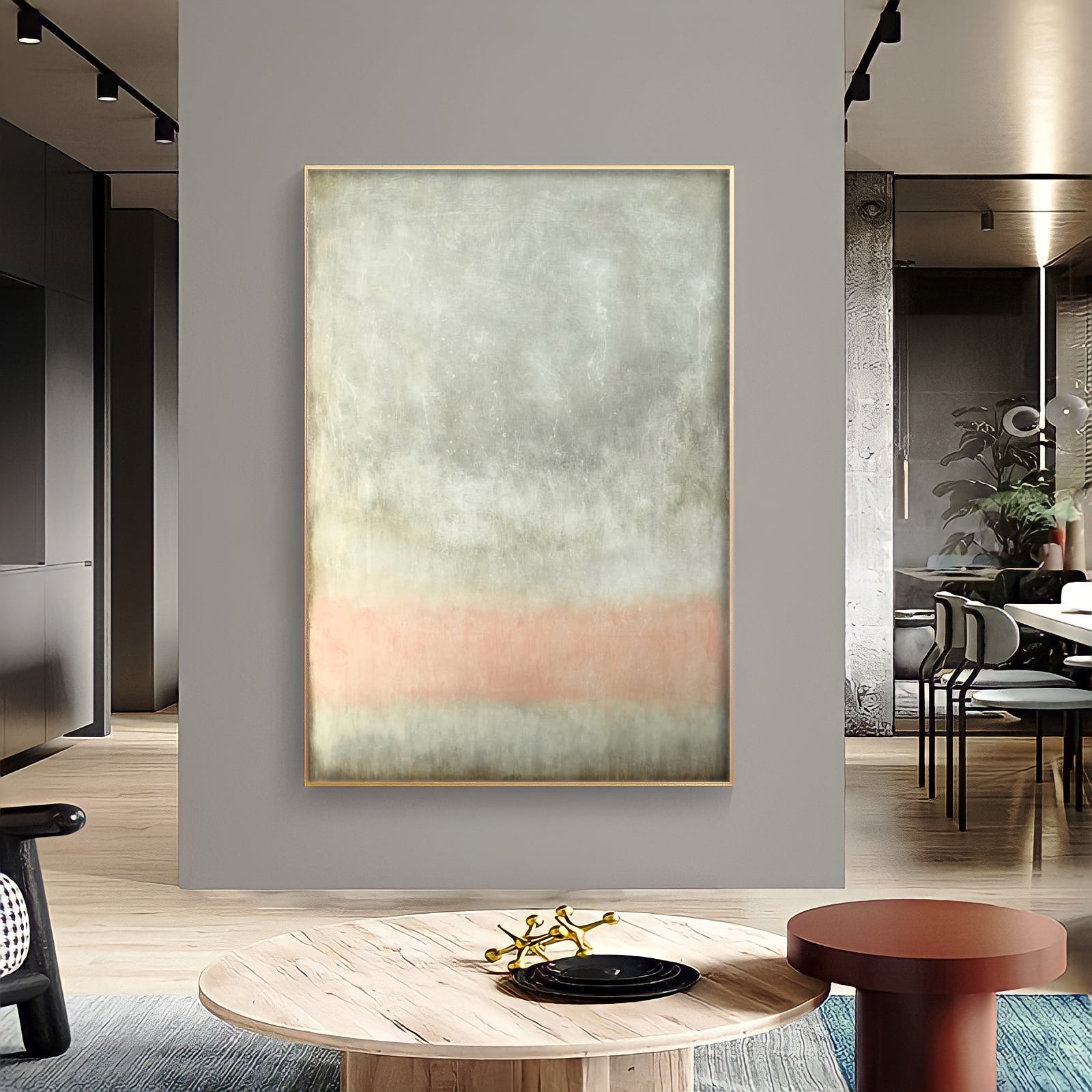 a living room with a large painting on the wall