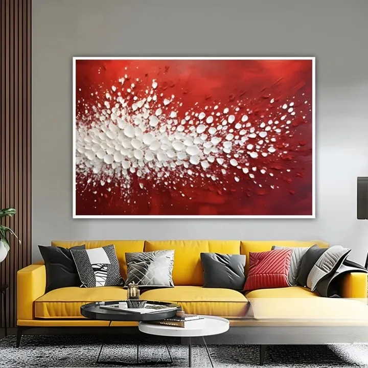a large, vibrant red abstract painting hanging on a wall above a yellow couch with various throw pillows.