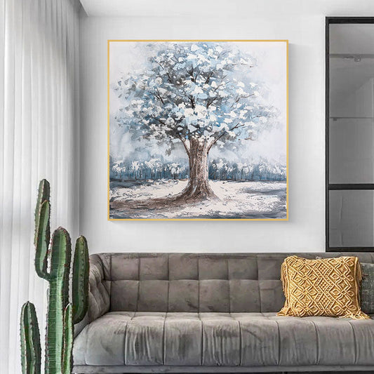 a living room with a couch and a painting on the wall