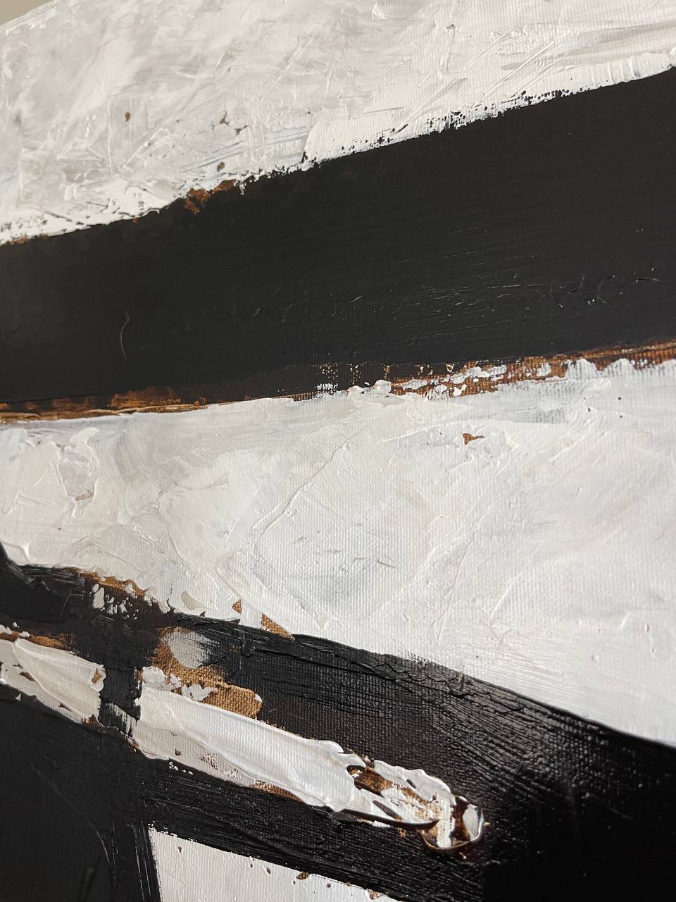 a close up of a black and white painting