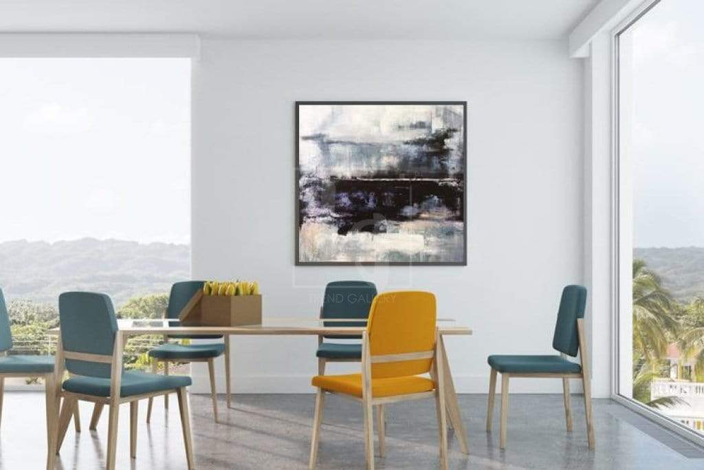 a room with a table, chairs and a painting on the wall