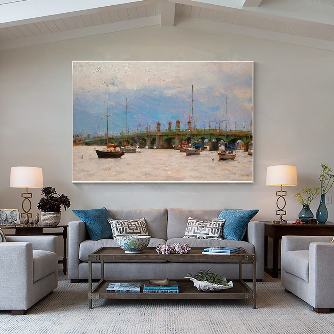 a living room filled with furniture and a painting on the wall