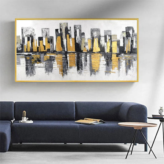 a living room with a couch and a painting on the wall