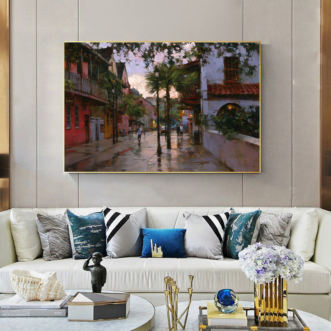 a living room filled with furniture and a painting on the wall