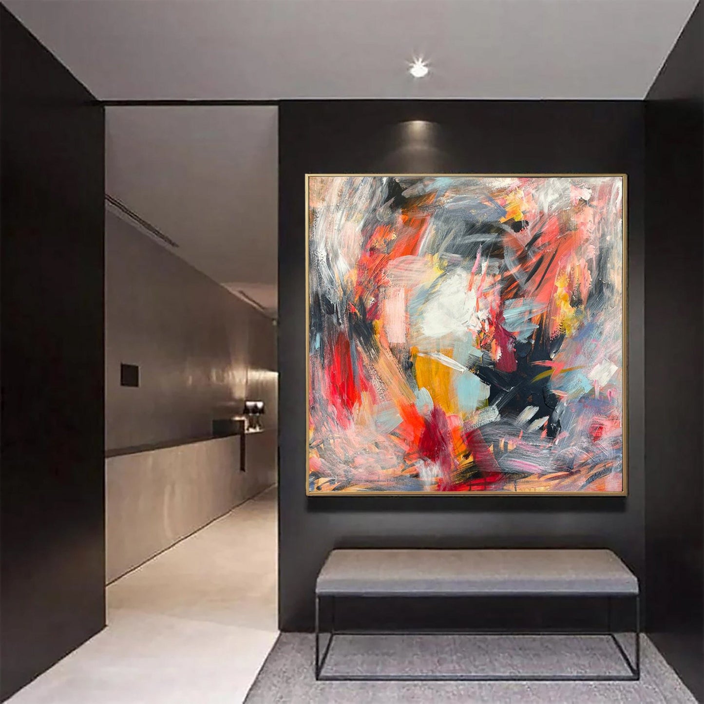 a large abstract painting hangs in a hallway