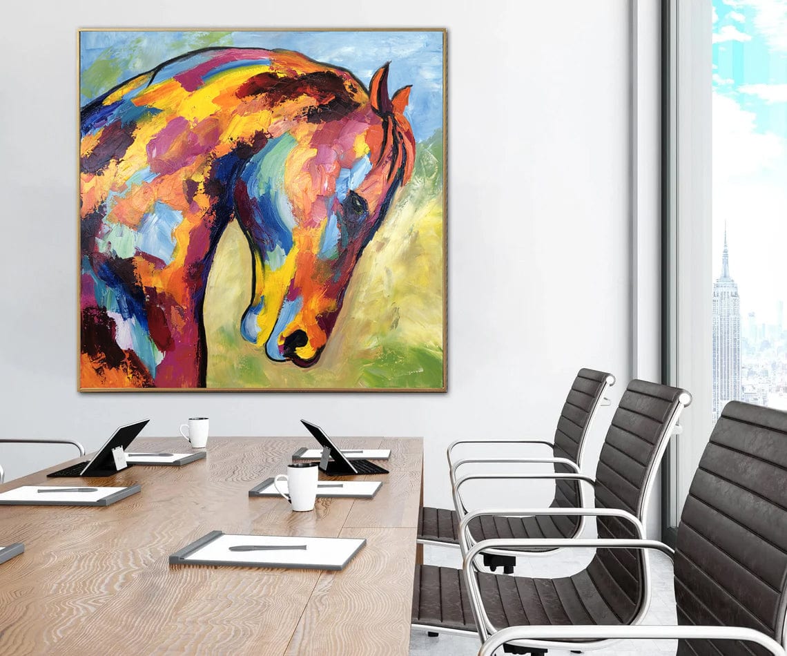 a painting of a horse on a wall above a conference table