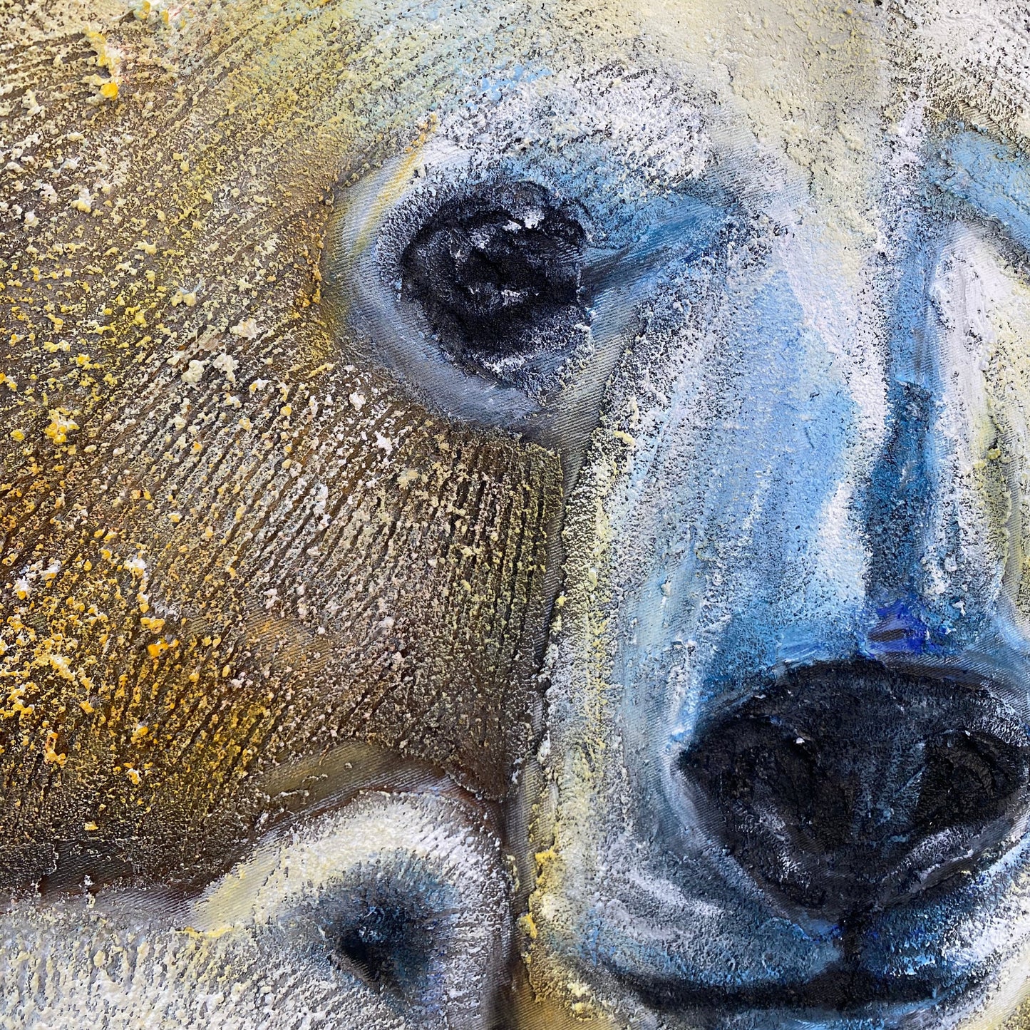 The image is a close-up of a polar bear's face, with its distinctive features such as the large eyes, small nose, and thick fur clearly visible.