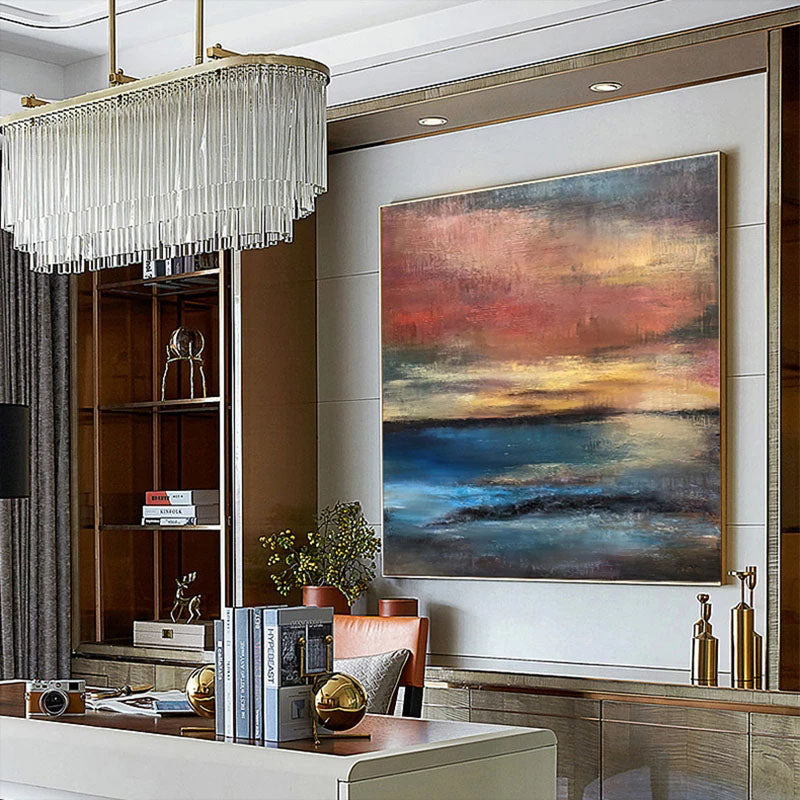 a living room filled with furniture and a painting on the wall