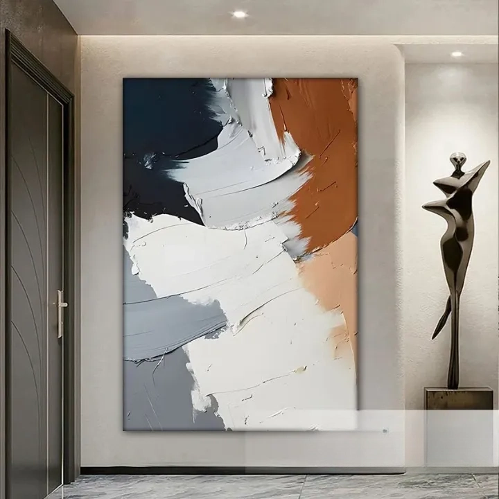 a large abstract painting hanging on a wall, with a sculpture to the right of it.
