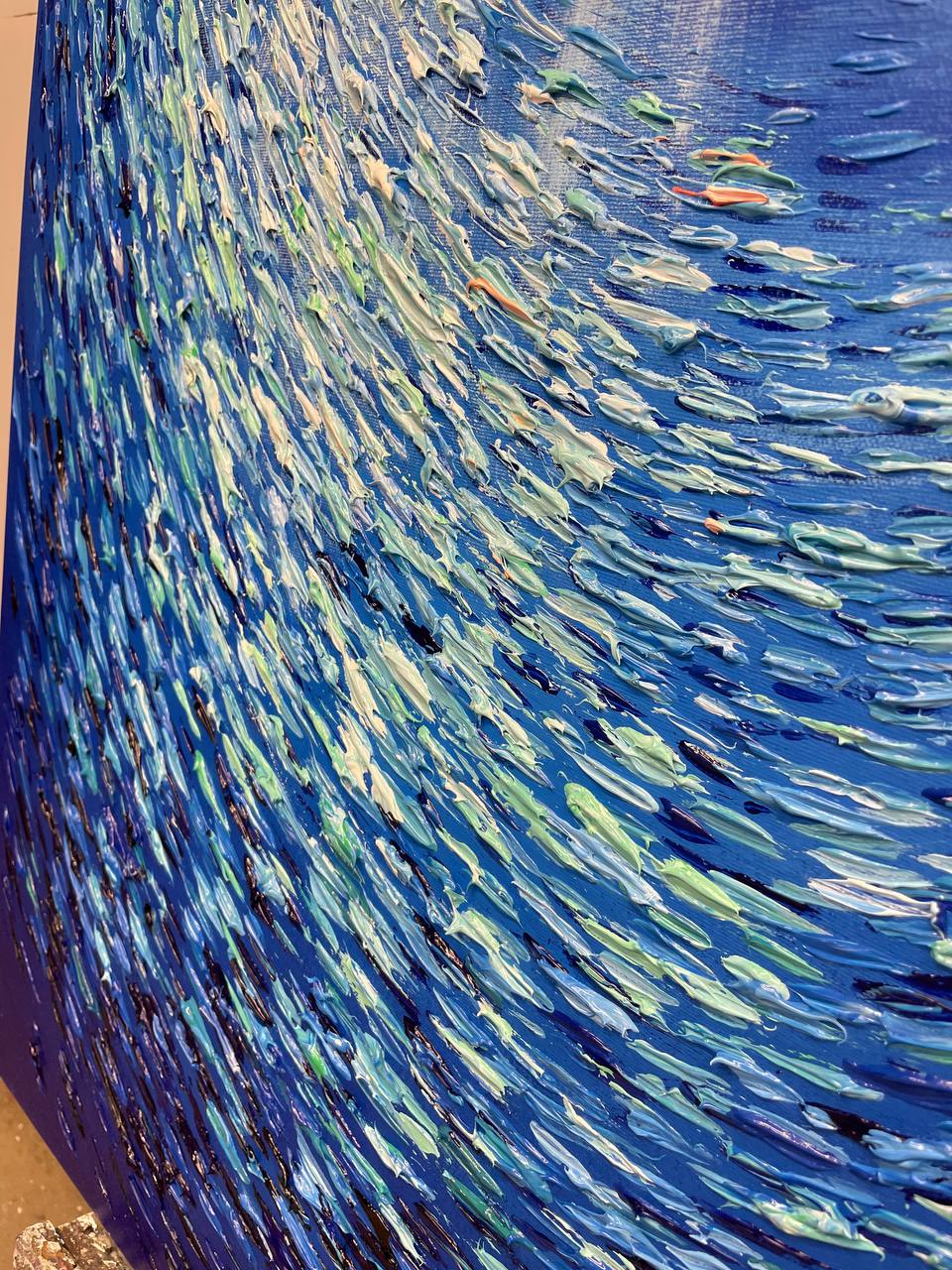 a painting of a wave on a wall