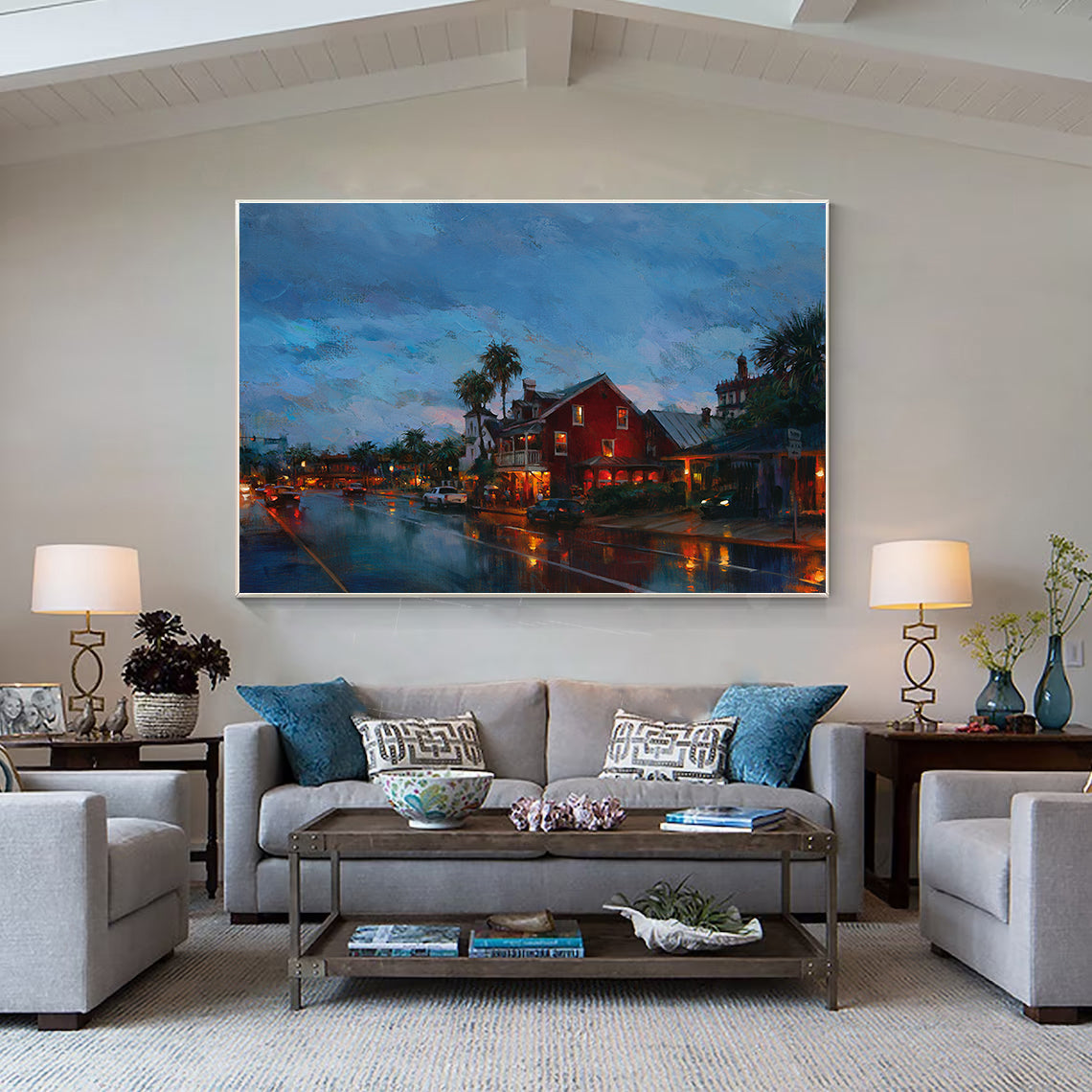 a living room filled with furniture and a painting on the wall