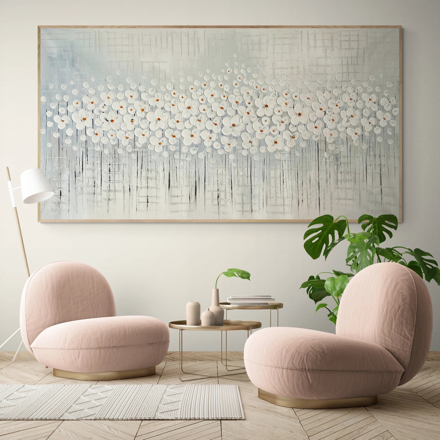 a living room with two pink chairs and a coffee table