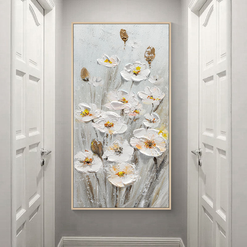 a painting of white flowers on a gray wall