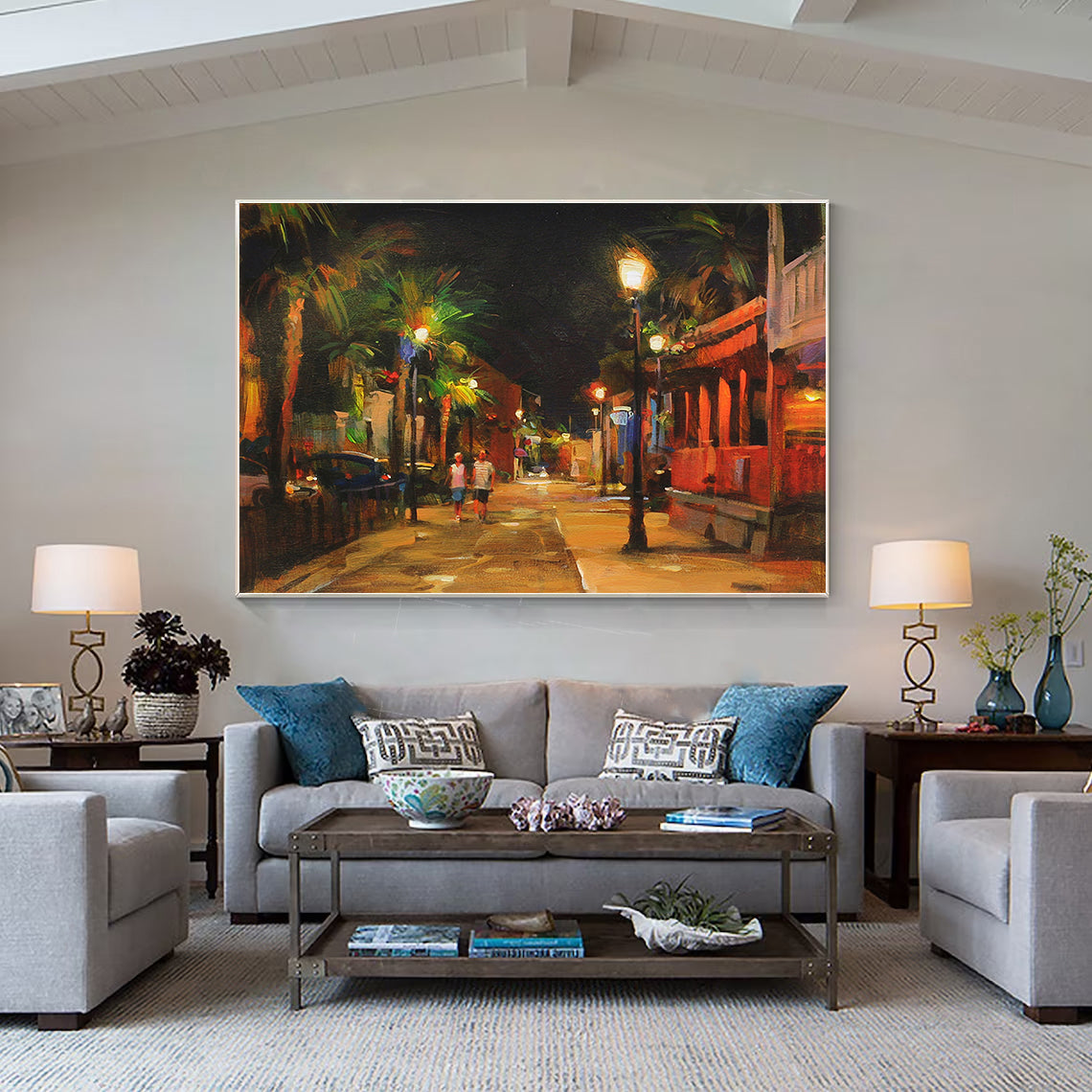 a living room filled with furniture and a painting on the wall