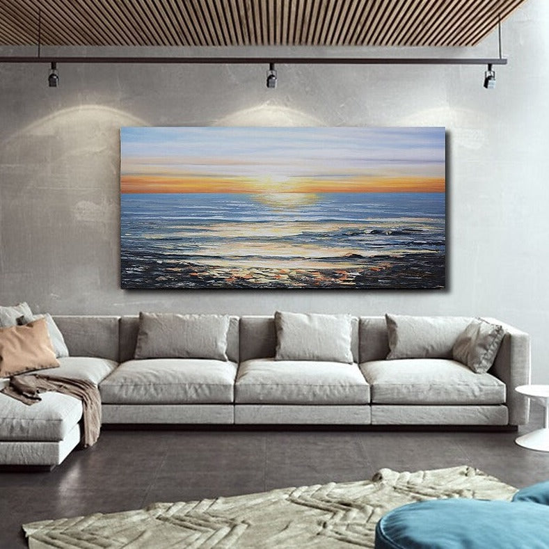 a living room with a couch and a painting on the wall