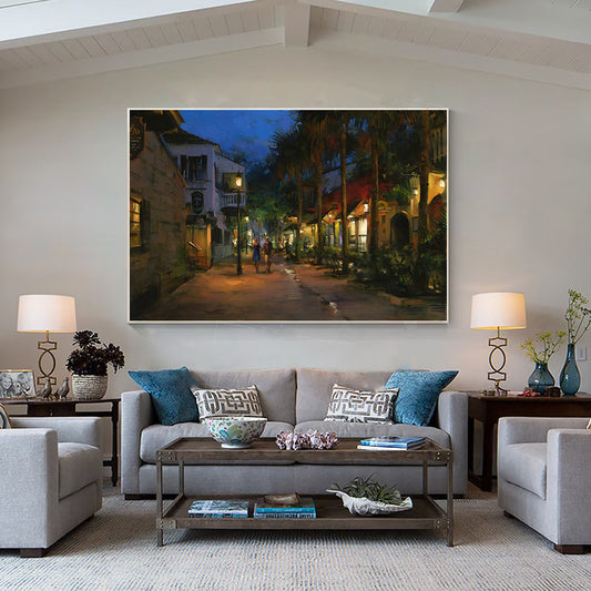 a living room filled with furniture and a painting on the wall