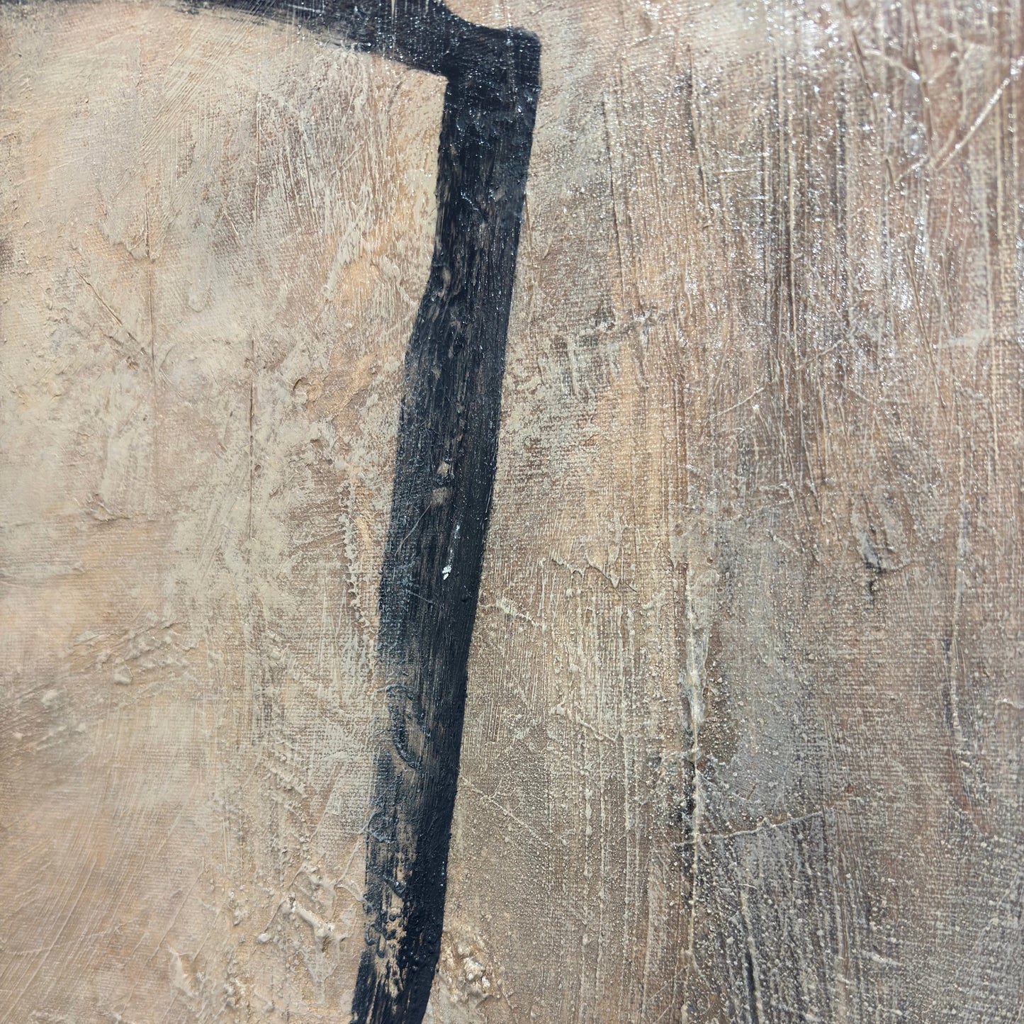 a close-up view of a textured surface with a black line running through it.