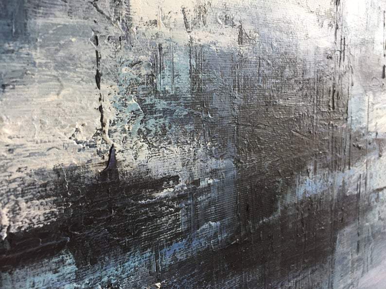 a close up of a black and white painting