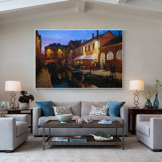 a living room filled with furniture and a painting on the wall