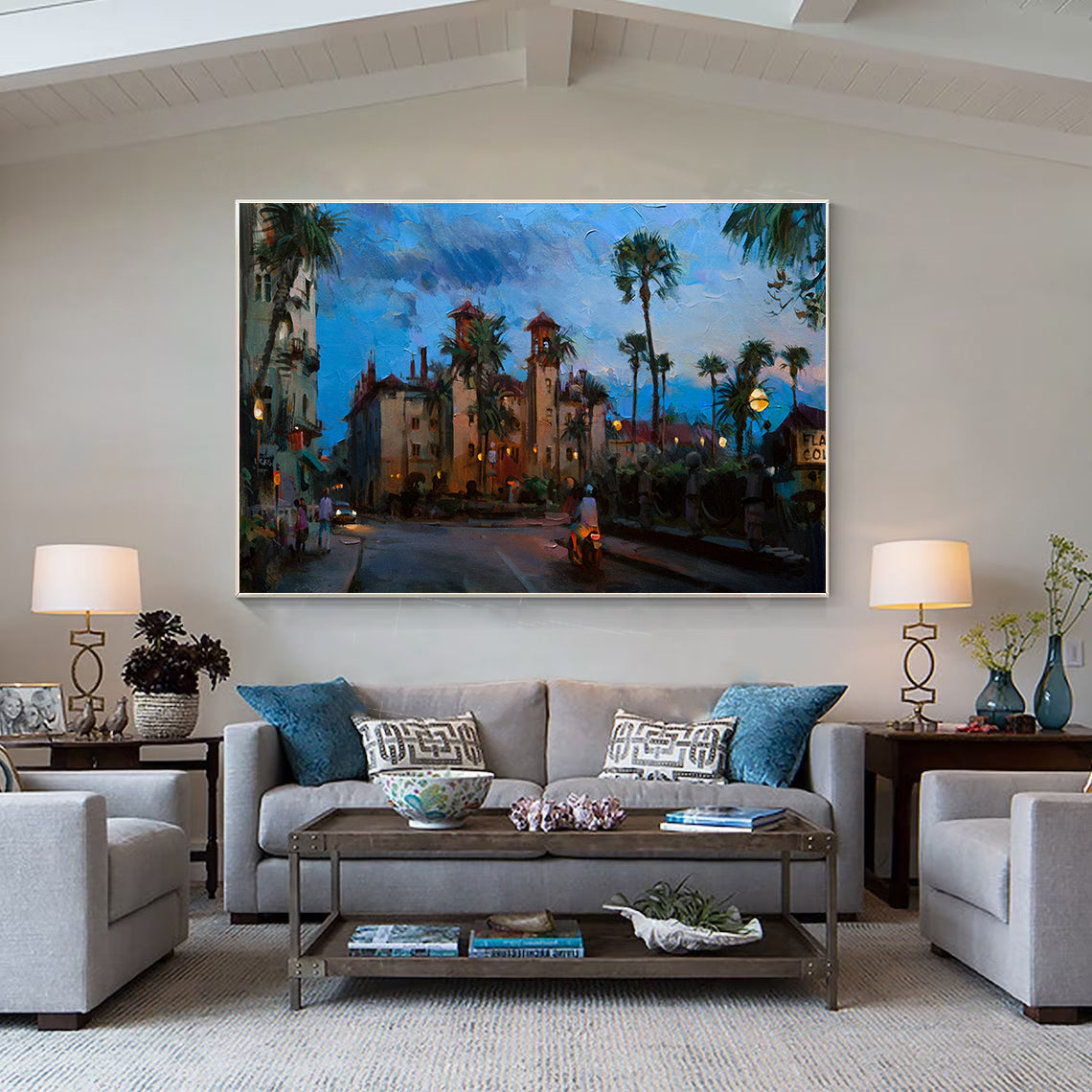 a living room filled with furniture and a painting on the wall