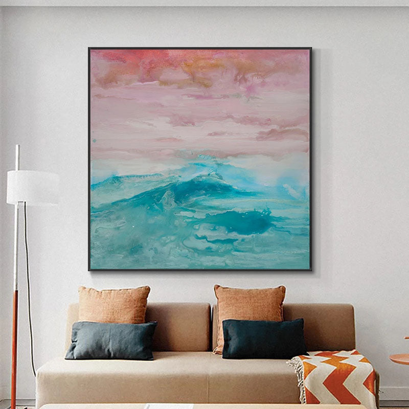 a living room with a couch and a painting on the wall