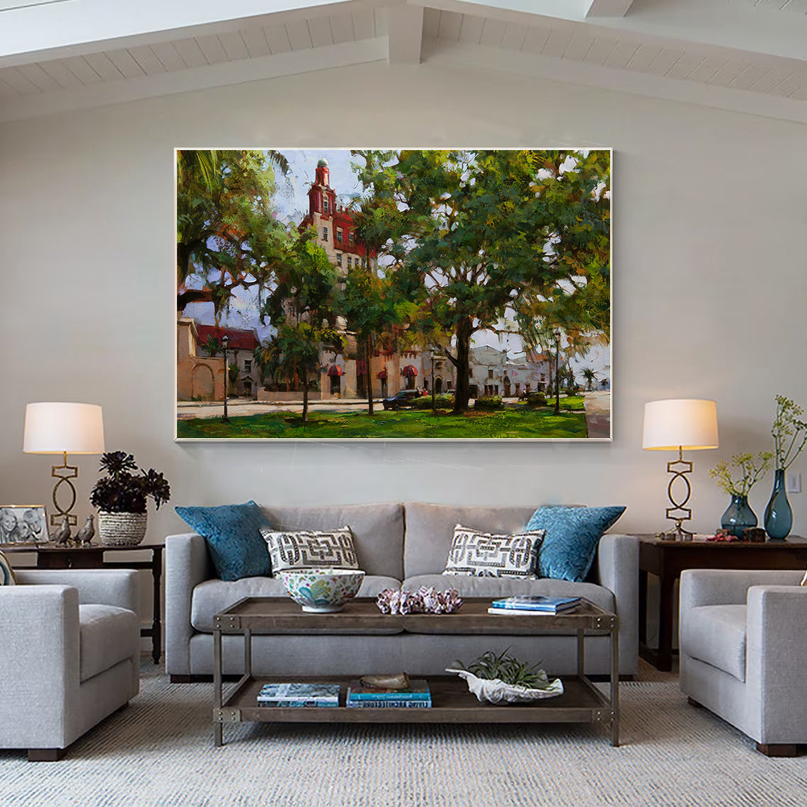 a living room filled with furniture and a painting on the wall