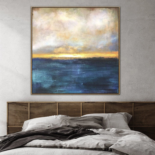 a large, vibrant painting of a seascape hanging above a bed with a wooden headboard.