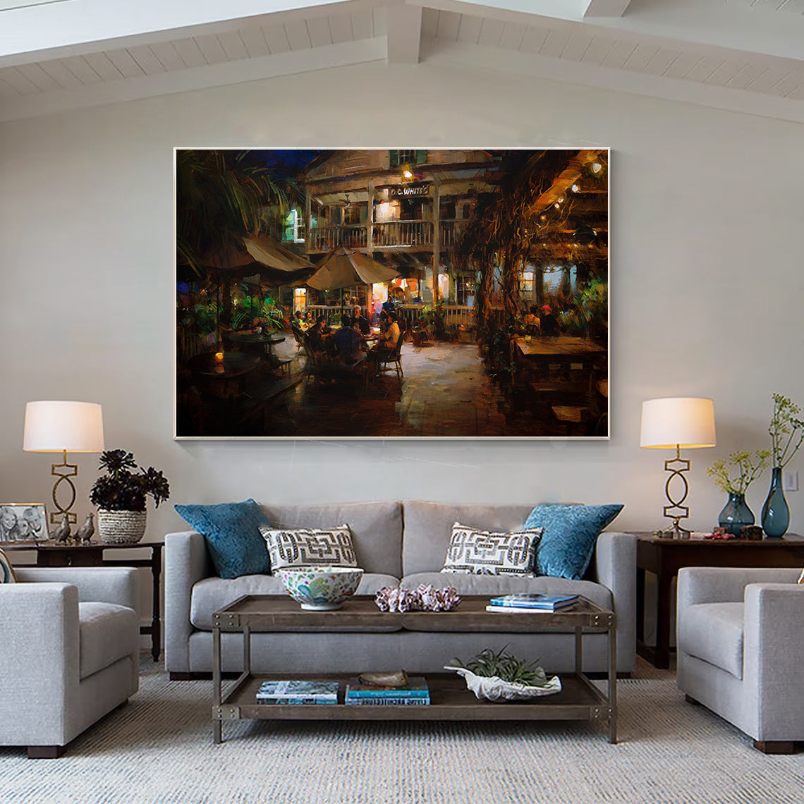 a living room filled with furniture and a painting on the wall