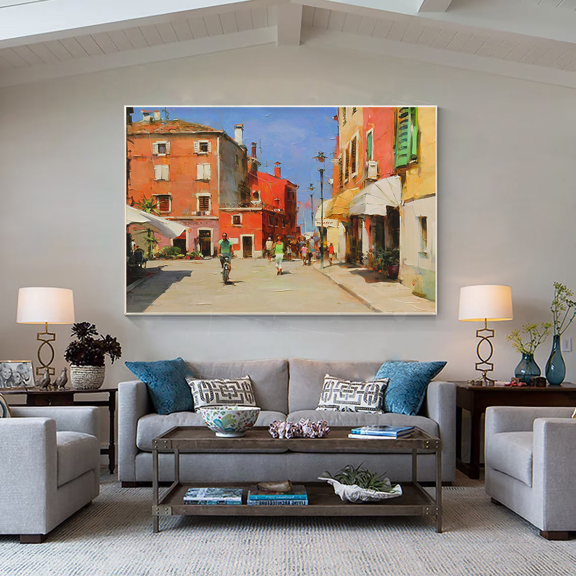 a living room filled with furniture and a painting on the wall