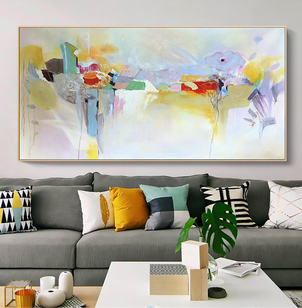 a living room with a large painting on the wall