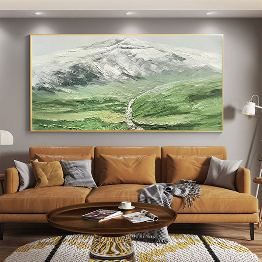 a living room with a large painting on the wall