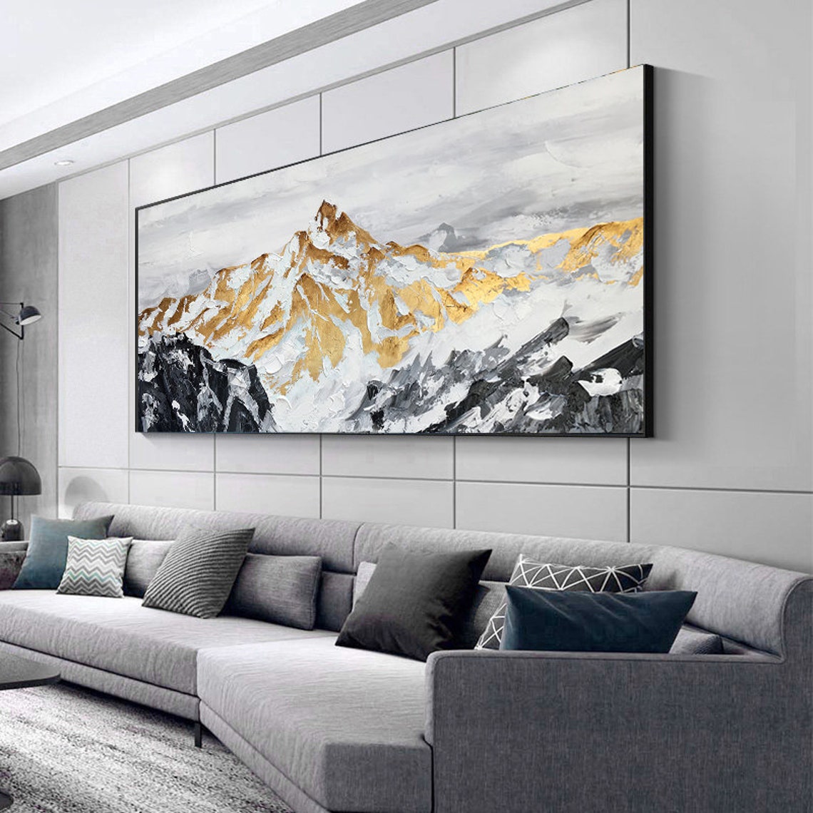 a living room with a large painting on the wall