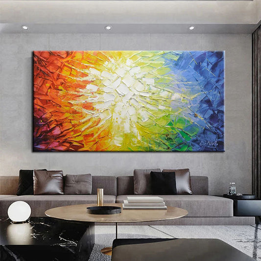 a living room with a large painting on the wall