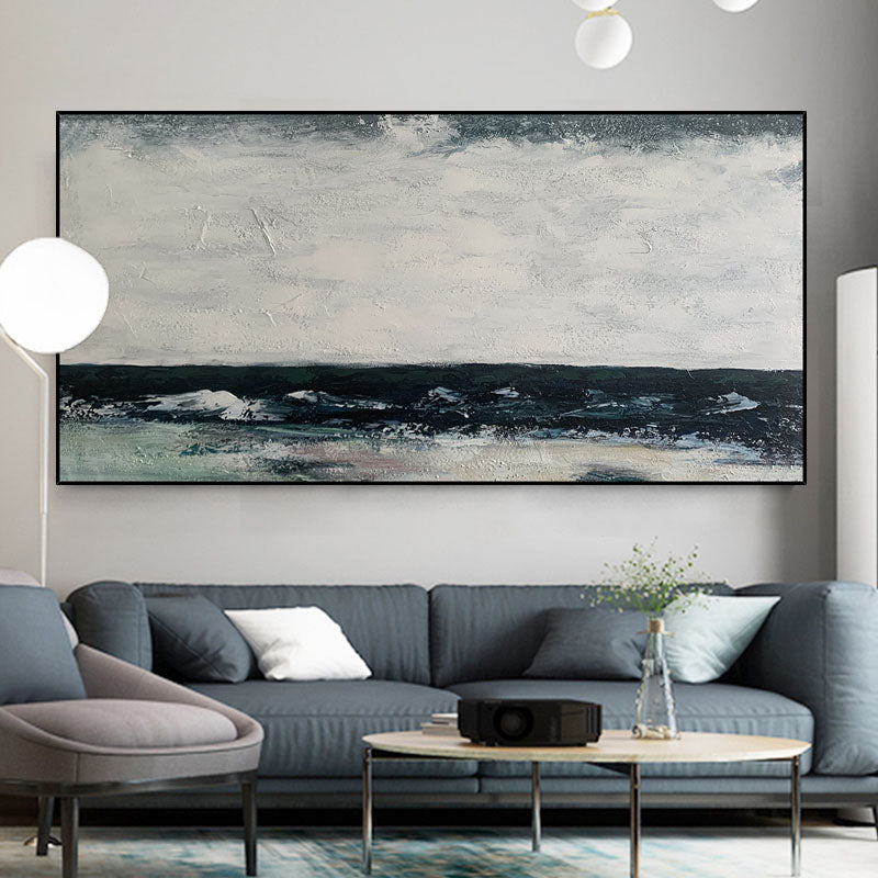 a living room with a large painting on the wall