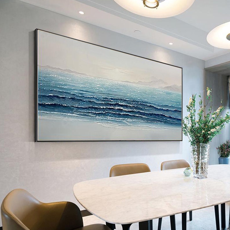 a dining room table with a vase of flowers on it