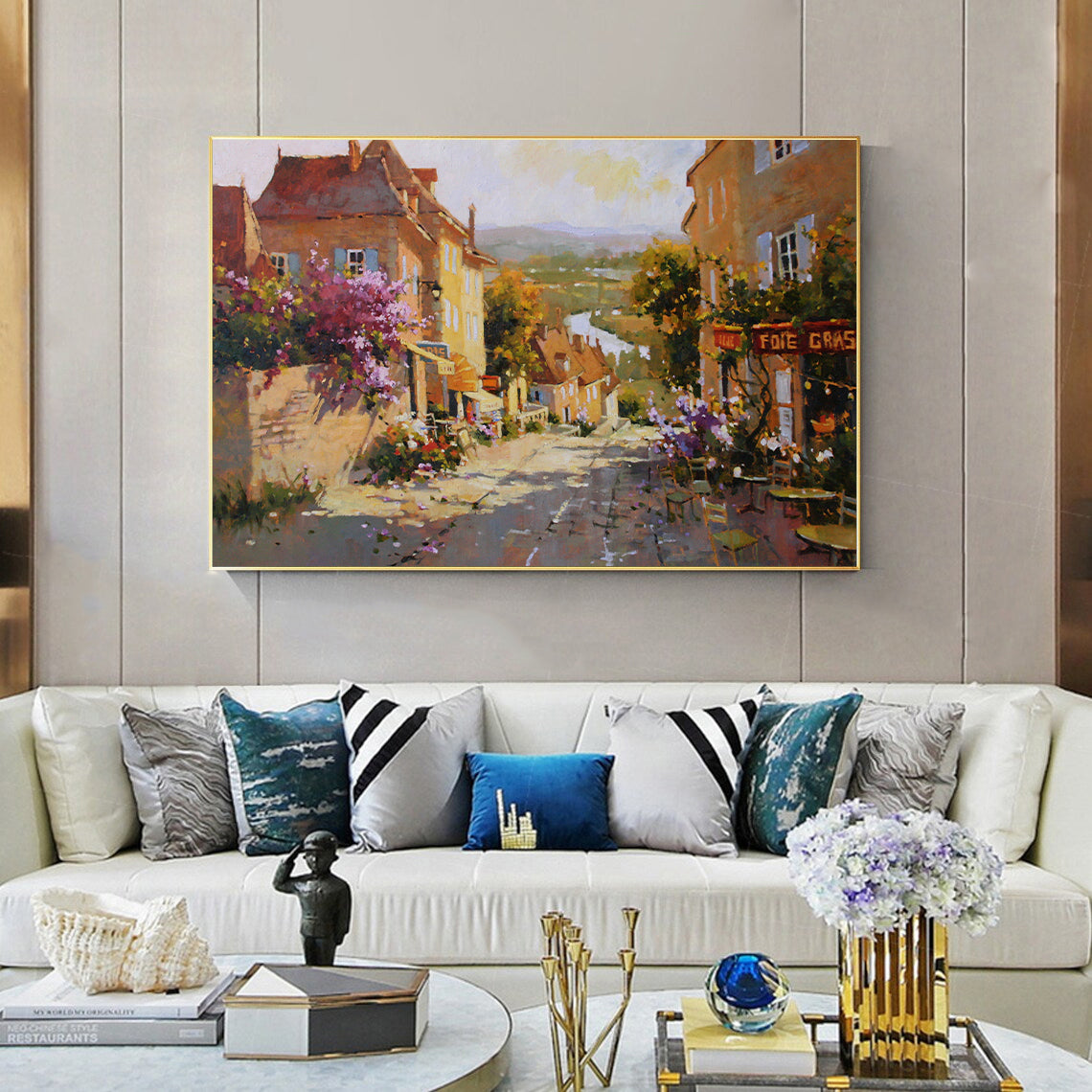 a living room filled with furniture and a painting on the wall