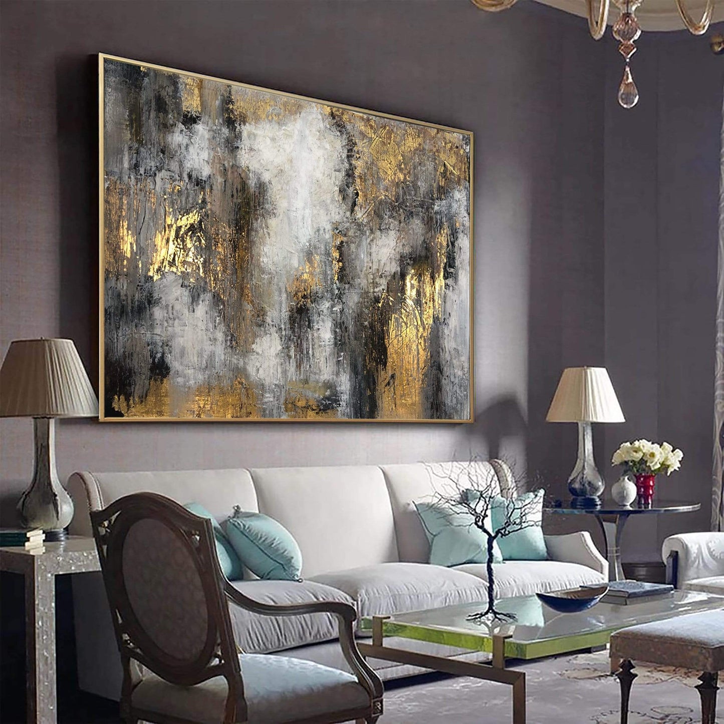 a living room filled with furniture and a painting on the wall