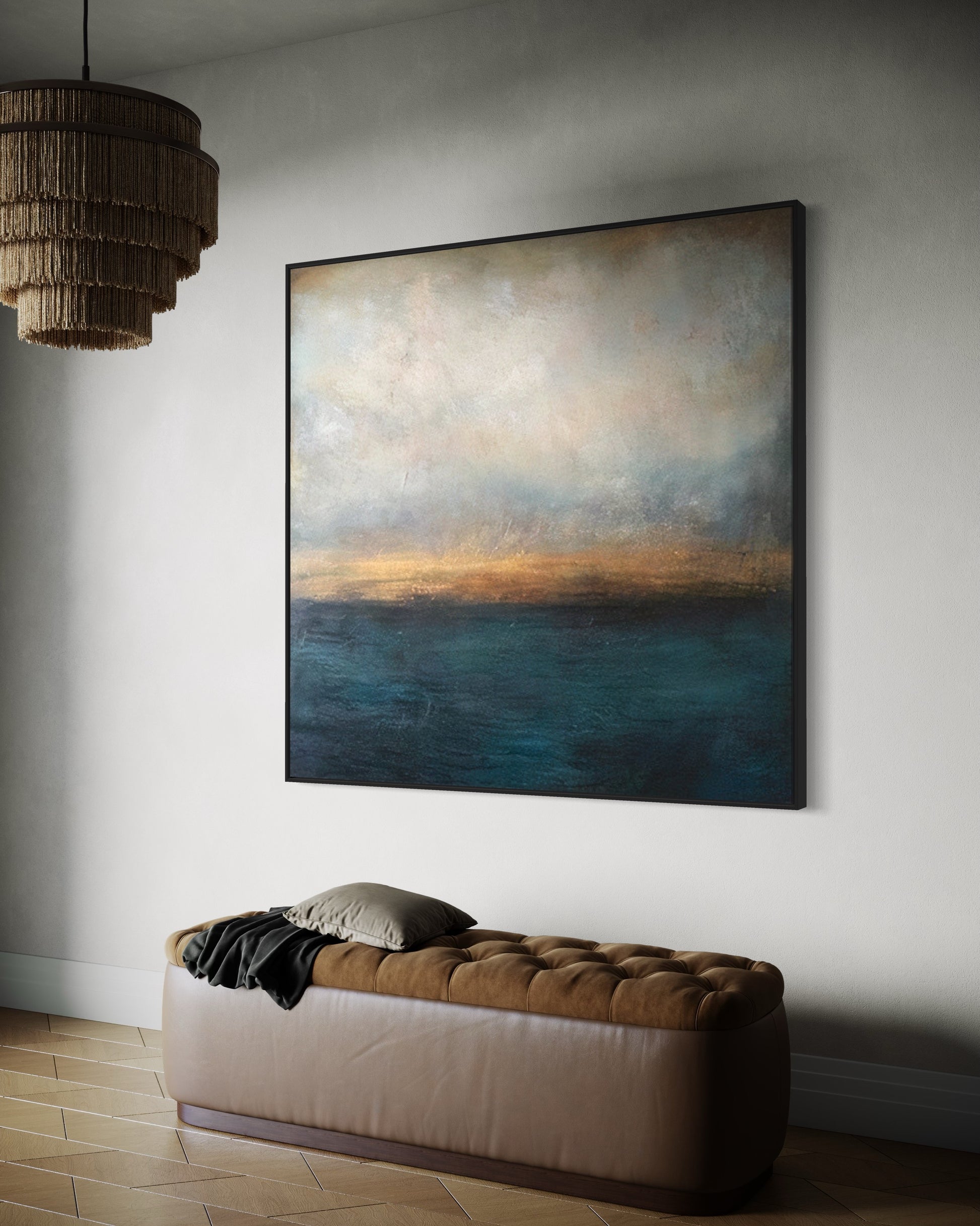 a painting hanging on a wall above a couch