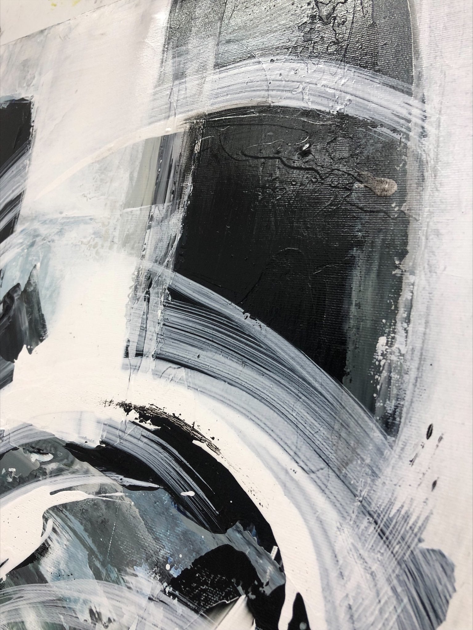 a black and white abstract painting on a wall