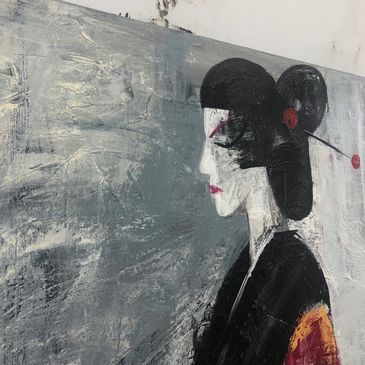 The image is a painting of a woman with a black headband and a red flower in her hair, set against a gray background.