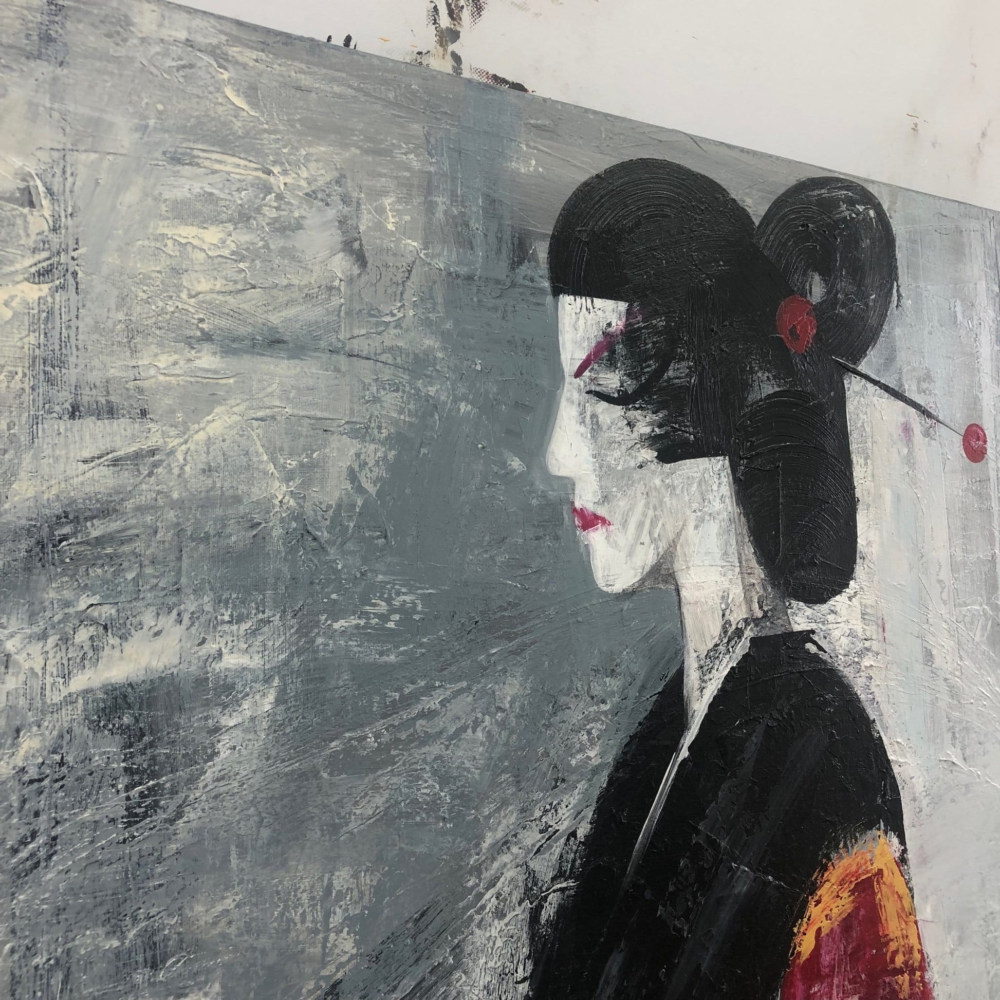 The image is a painting of a woman with a black headband and a red flower in her hair, set against a gray background.