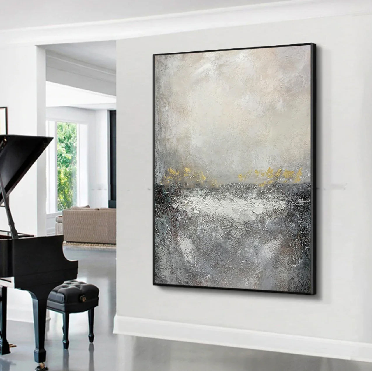 a piano in a room with a large painting on the wall