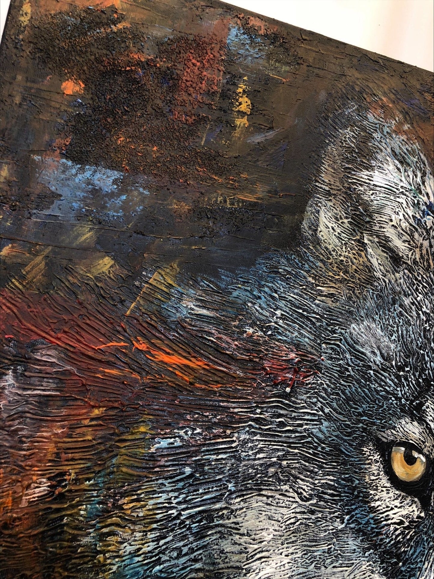 a painting of a cat with yellow eyes