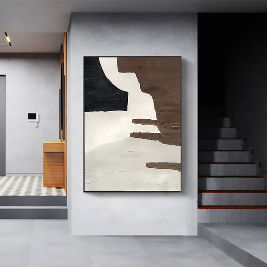 a painting hanging on a wall next to a stair case