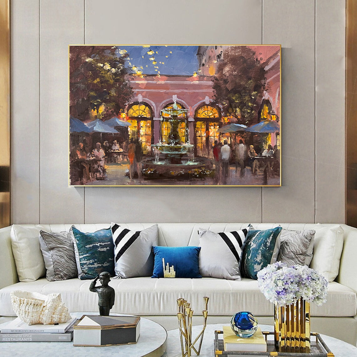 a living room filled with furniture and a painting on the wall