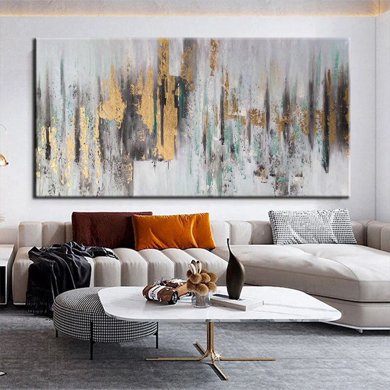 a living room with a large painting on the wall