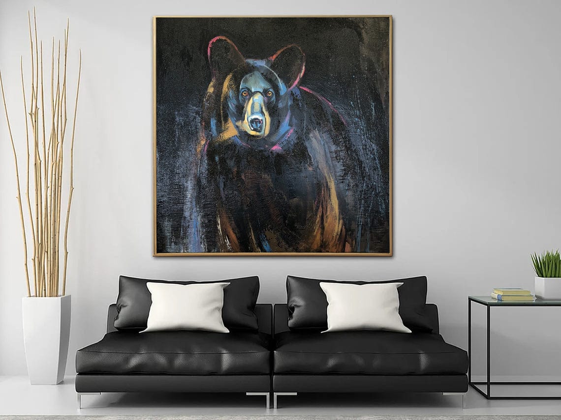 a living room with a couch and a painting on the wall