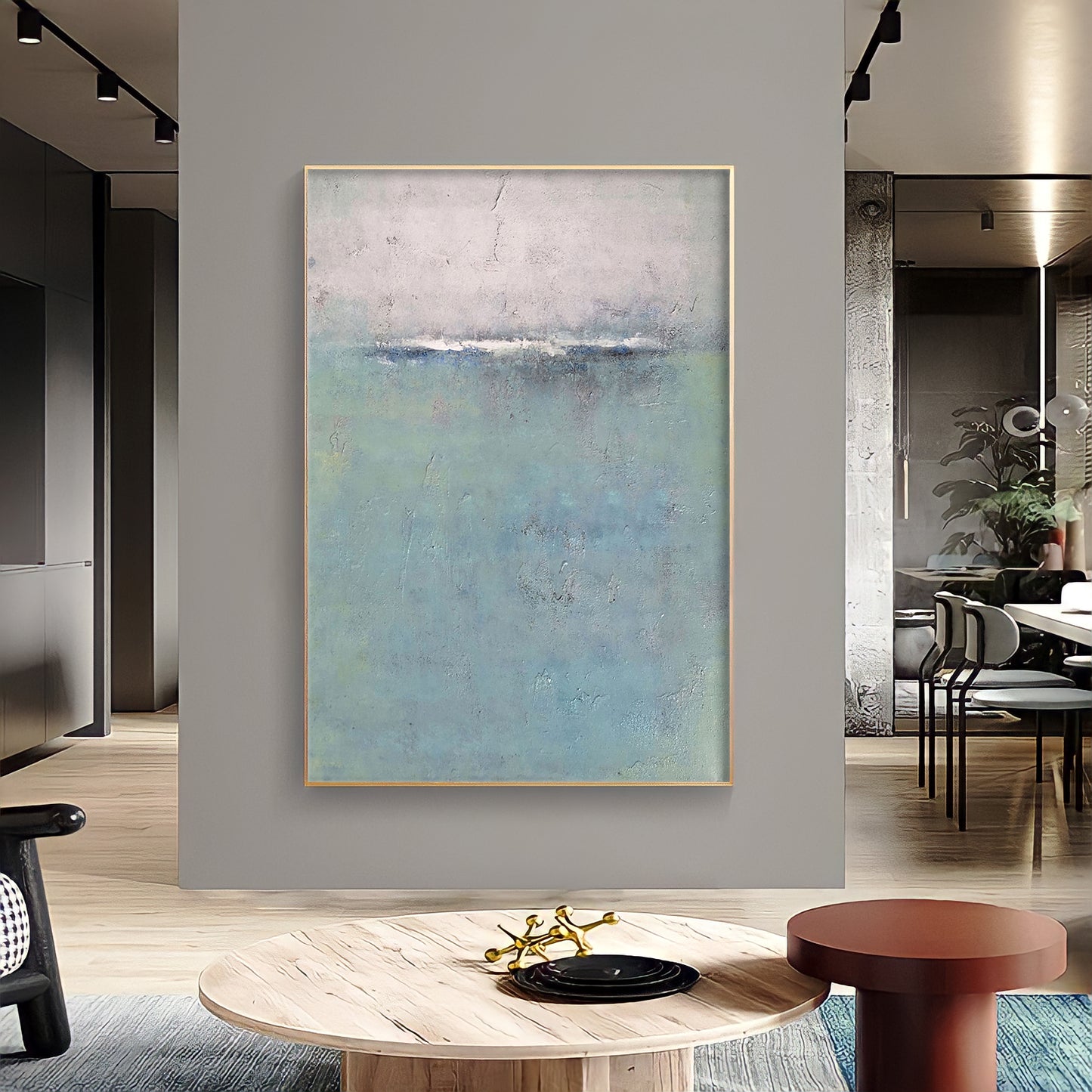 a painting hanging on a wall in a living room