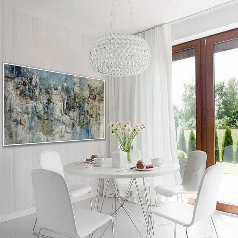 a dining room with a white table and white chairs